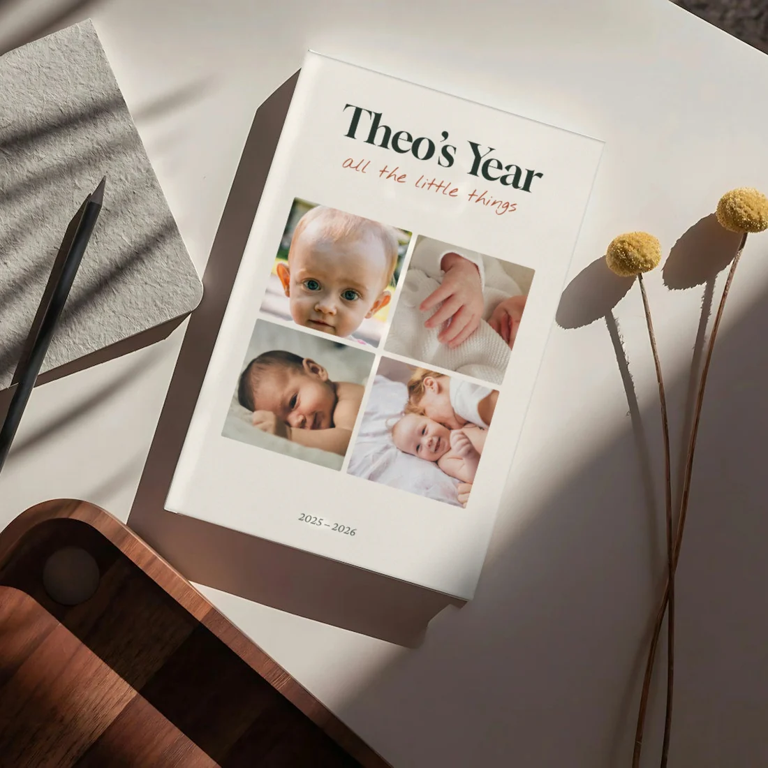 A Theo&rsquo;s First Year book on a tray with dried flowers