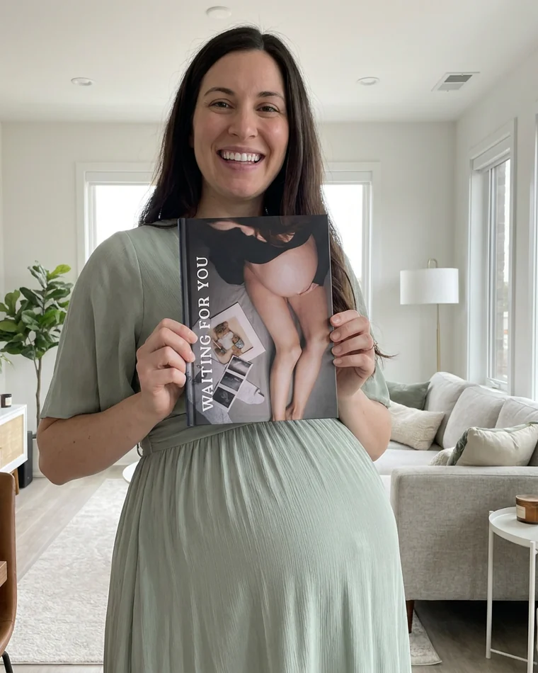 Pregnant woman holding her Waiting For You book