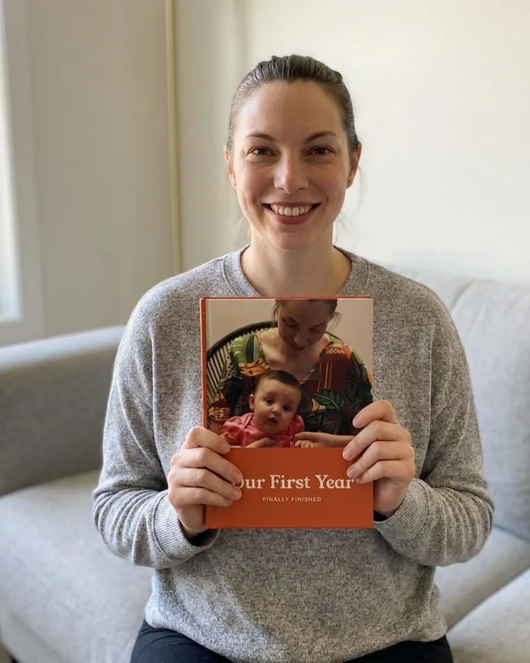 Mom holding her Our First Year book